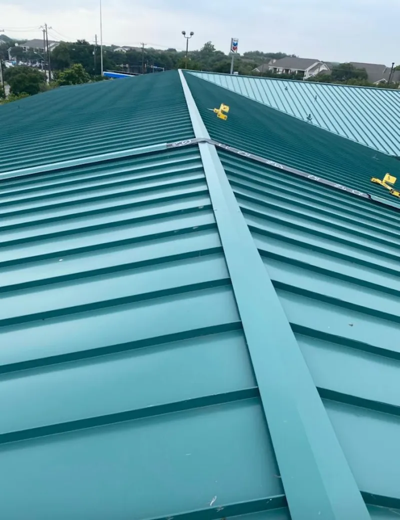 Green commercial metal roof ridge and valley for Metal Roof Repair in Williamstown