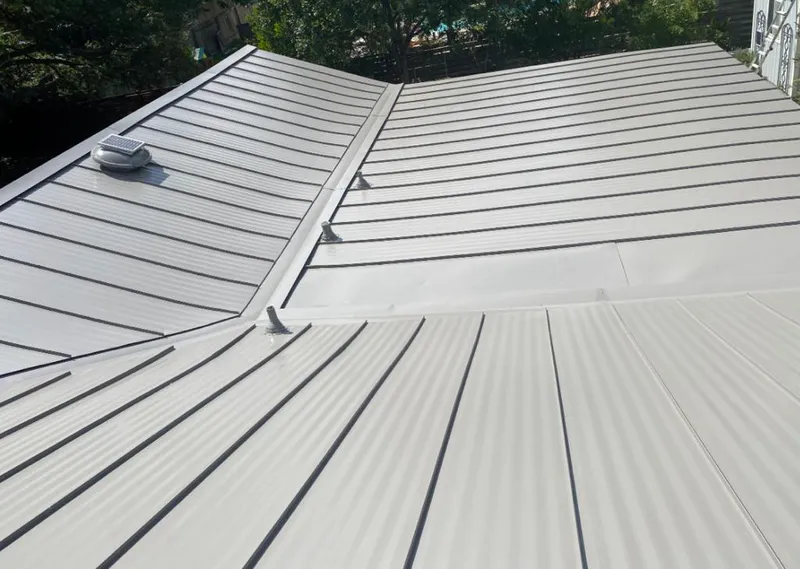 Solar attic fan installed on a metal roof for Roof Ventilation in Williamstown